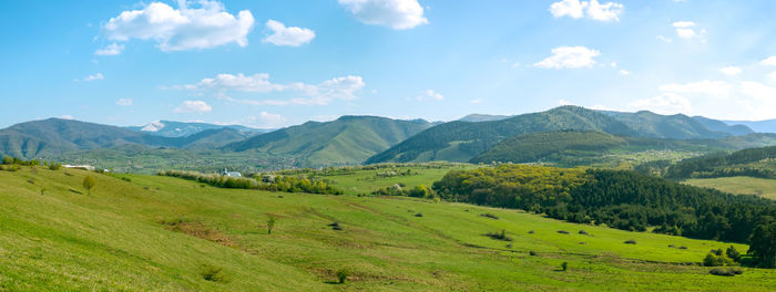 Scenic view of landscape and mountains against sky