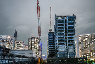 Low angle view of buildings against sky in city