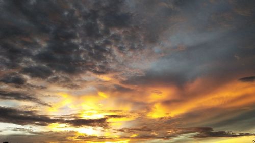 Low angle view of dramatic sky during sunset