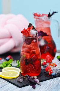 Close-up of fruits on glass table