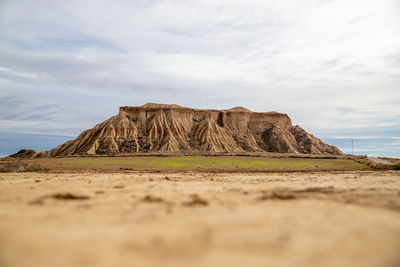 Rock formations on land against sky