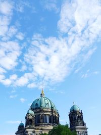 Low angle view of berlin cathedral against cloudy sky