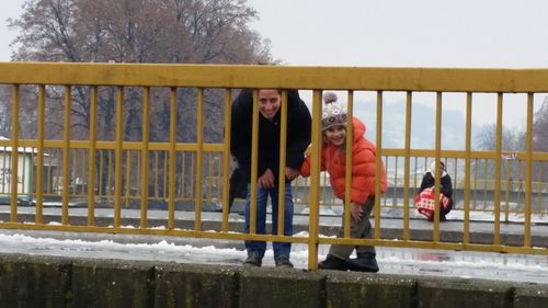 People on snow covered park during winter