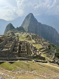 High angle view of townscape and mountains against sky