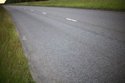 Close-up of road on grass