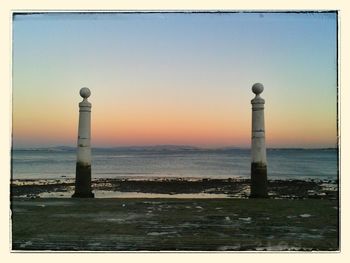 Scenic view of sea against sky at sunset