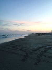 Scenic view of beach at sunset