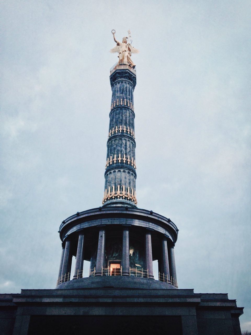 low angle view, sky, building exterior, tower, built structure, tall - high, cloud - sky, architecture, technology, cloud, no people, day, outdoors, old-fashioned, metal, cloudy, industry, close-up, protection, modern