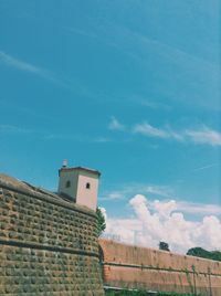 Low angle view of built structure against blue sky