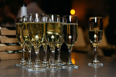 Close-up of wineglasses on table