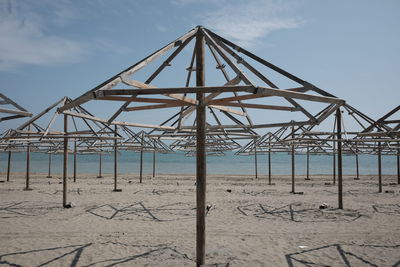 Built structure on beach against sky