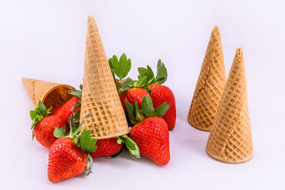 Close-up of chopped fruits against white background