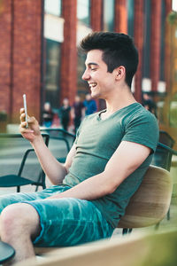 Young man using mobile phone