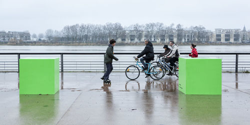 Man riding bicycle in water