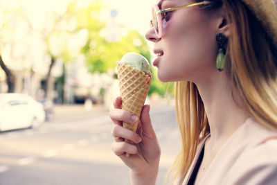 Midsection of woman holding ice cream