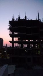 View of buildings against sky at sunset