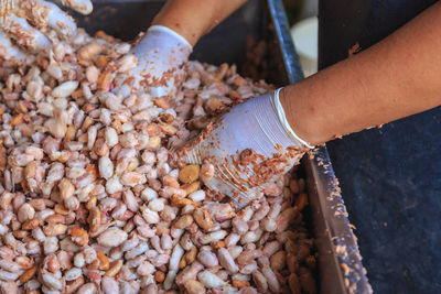 High angle view of hand preparing food at market