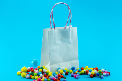 Multi colored candies against blue background