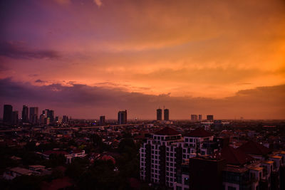 High angle view of buildings against sky during sunset