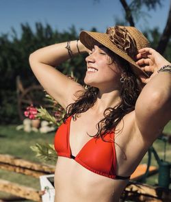 Midsection of woman wearing hat