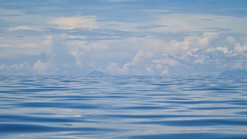 Scenic view of sea against cloudy sky