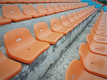 Empty chairs in row at stadium