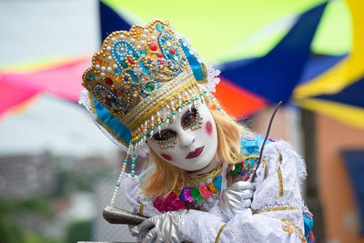 People dressed in different styles are seen playing at the carnival in the city of maragogipe,