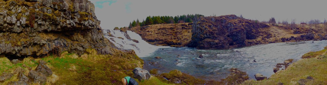 water, scenics, tranquility, tranquil scene, beauty in nature, rock - object, rock formation, nature, cliff, idyllic, high angle view, non-urban scene, tree, rock, sea, sky, day, geology, clear sky, landscape