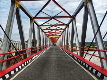 Bridge over footbridge against sky