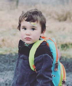 Portrait of cute boy with backpack