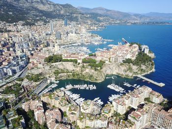 Aerial view of city by sea