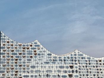 Low angle view of modern building against sky