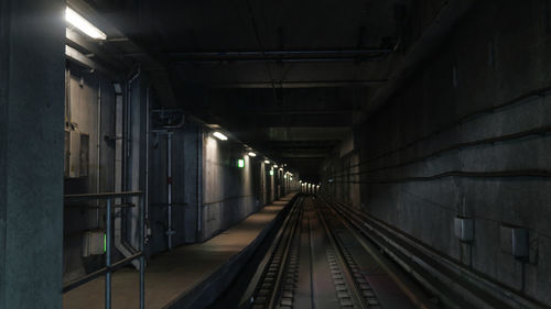 Interior of illuminated railroad tunnel