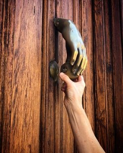 Close-up of hand holding knob