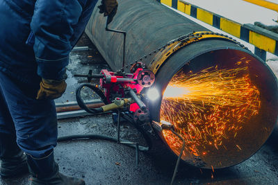 Low section of man working on street