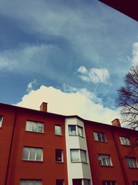 Low angle view of building against cloudy sky