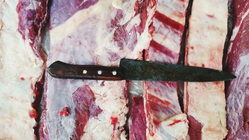 Full frame shot of meat with knife