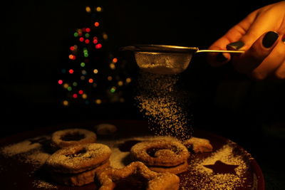 Midsection of person holding cookies