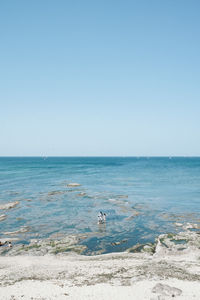 Scenic view of sea against clear sky