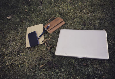 High angle view of laptop on field