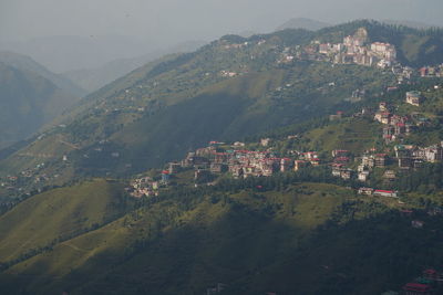 Aerial view of townscape and mountains