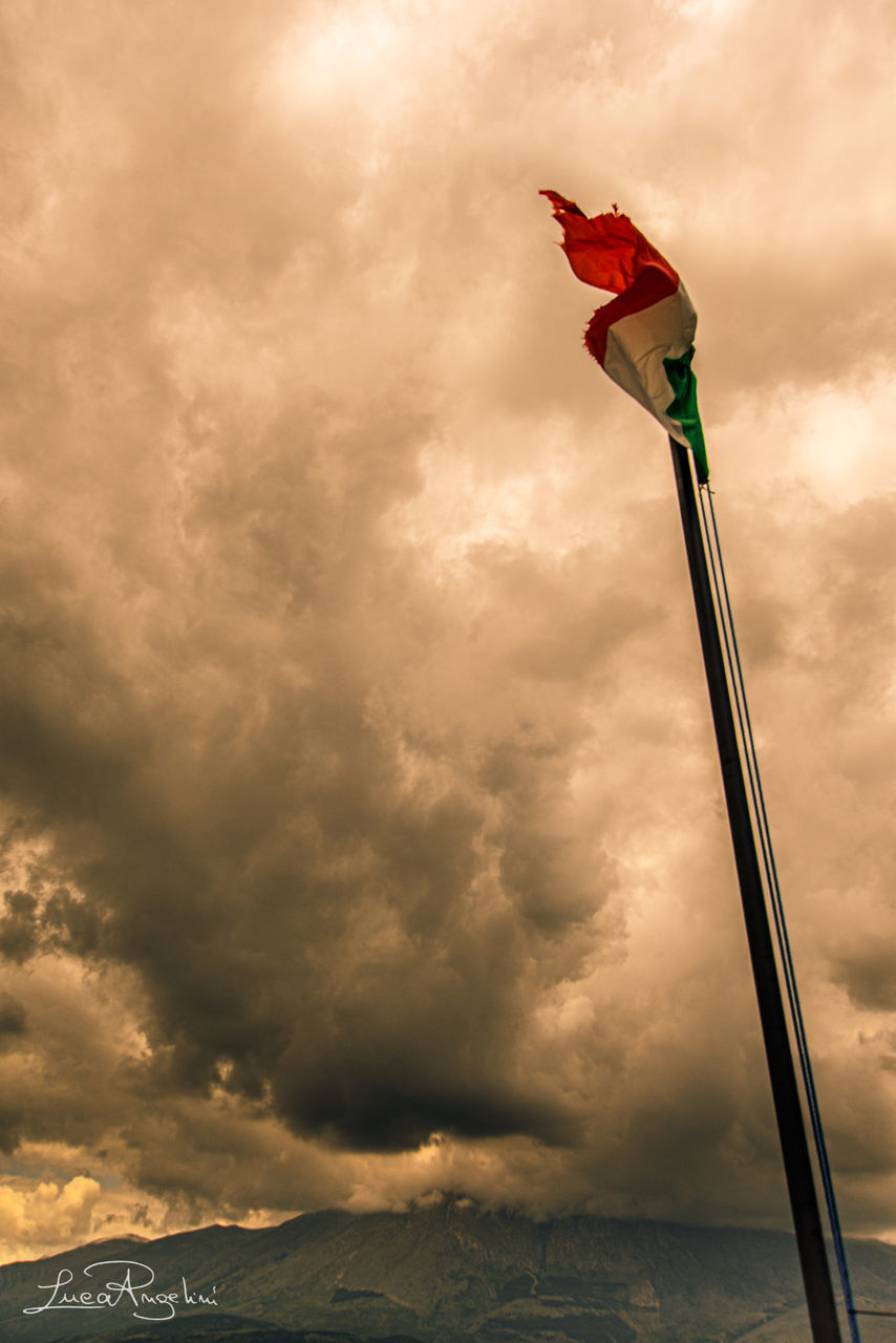 cloud, sky, flag, nature, wind, environment, patriotism, water, no people, storm, beauty in nature, outdoors, cloudscape, red, dramatic sky, overcast, morning, emotion