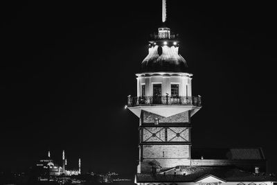 Low angle view of illuminated building against sky at night