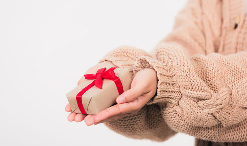 Close-up of gift box against white background