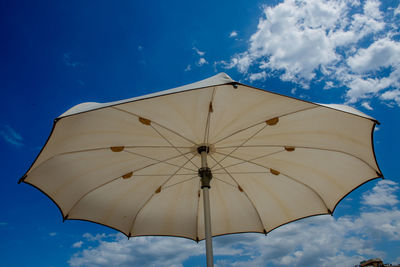 White umbrellas open on a beautiful sunny day