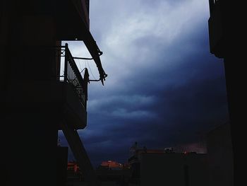 Low angle view of illuminated building against sky at night