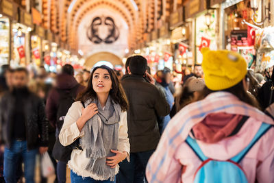 Woman standing on street market in city