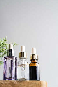 Close-up of bottles against white background