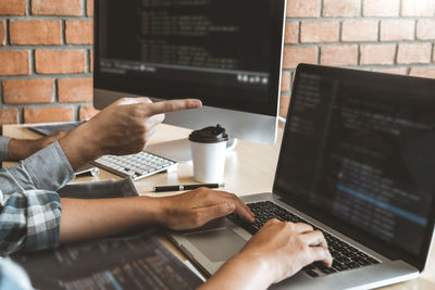 Man using laptop on table