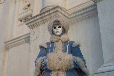 Low angle view of statue against building